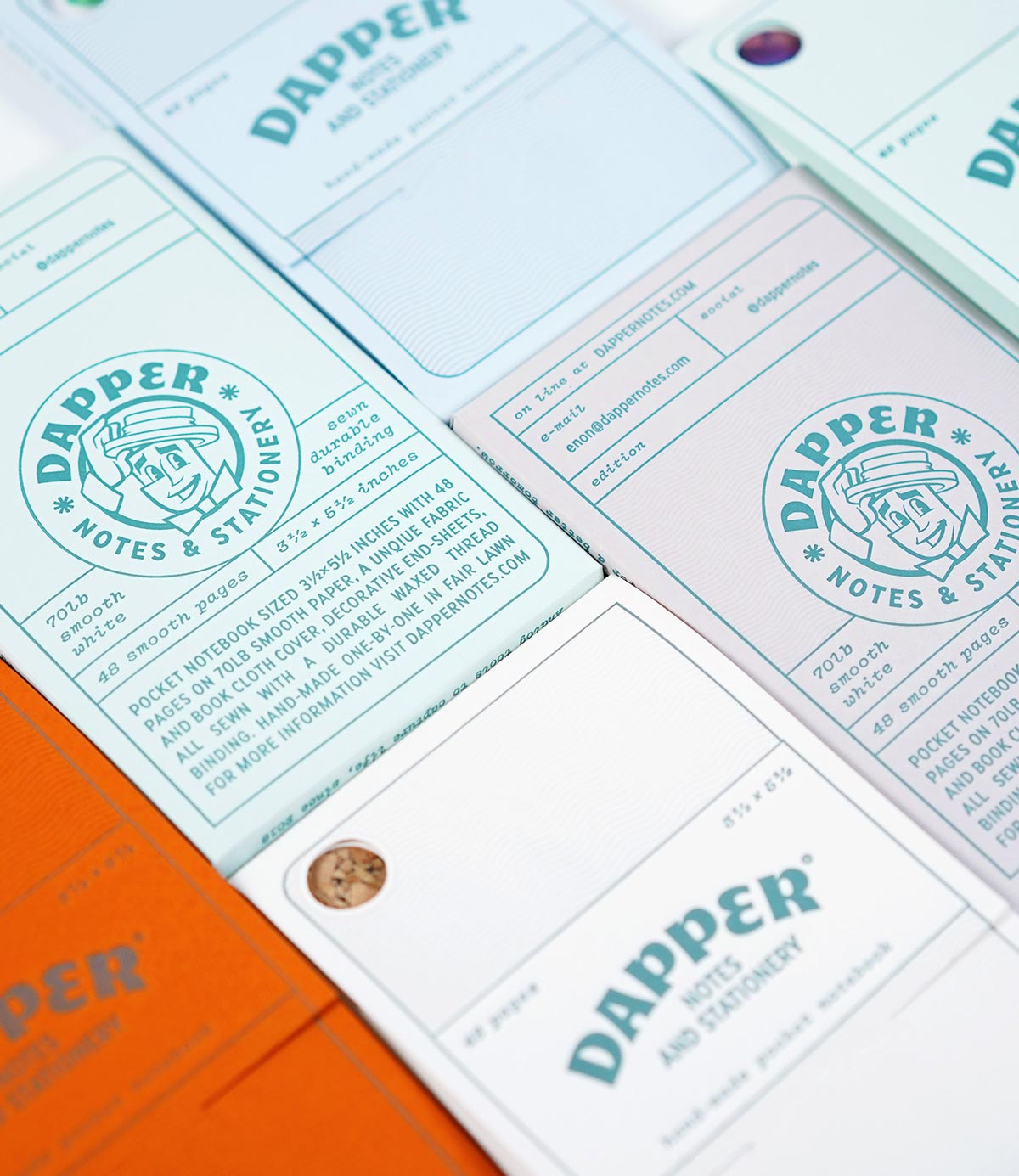 paper notebook packaging in a variety of colors. designed by enon avital, and printed by mama's sauce in etterpress for dapper notes.