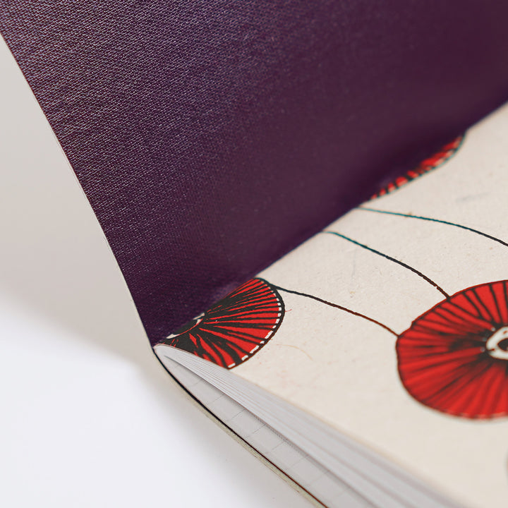 plum-colored book cloth, and a screen printed lokta plant paper