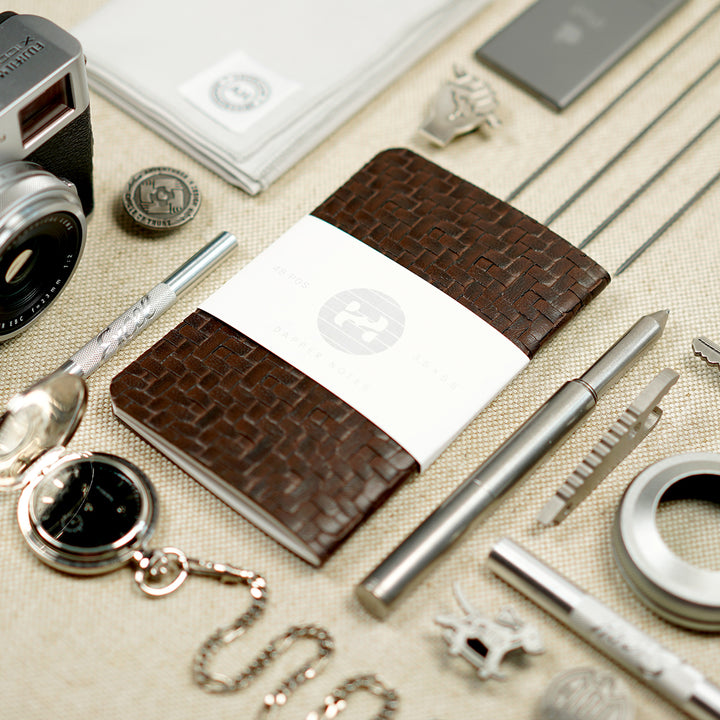 arranging items neatly notebook EDC pen, exacto, camera, fujifilm x100f, handkerchief