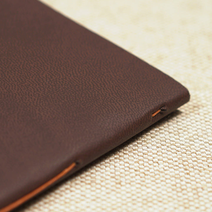 orange thread on leather cover