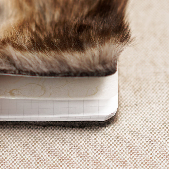 inside a fur-covered journal