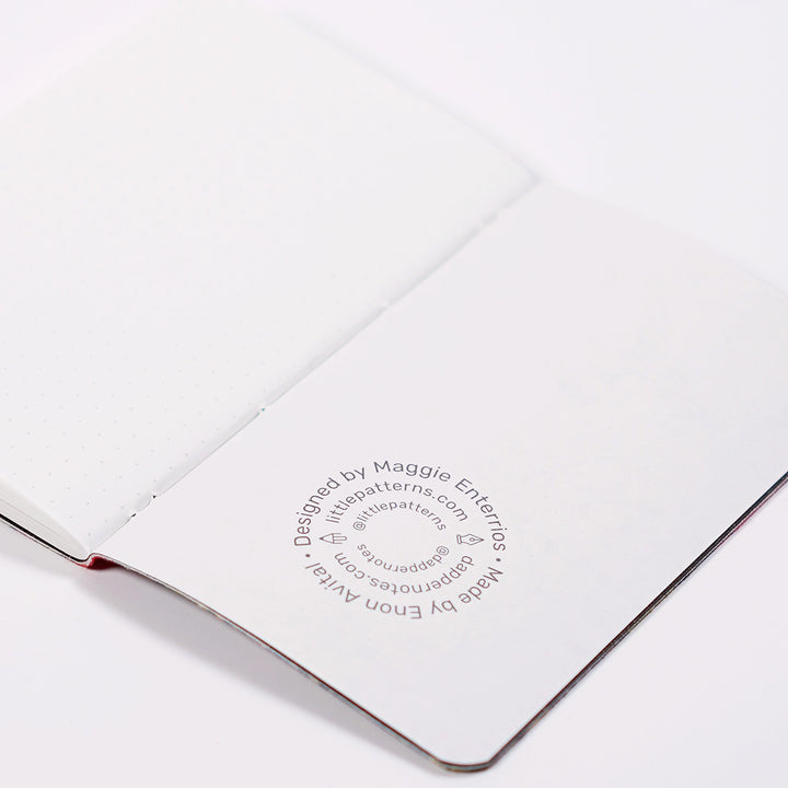 maker's mark from inside the journal, showing designer Maggie Enterrios and Enon Avital