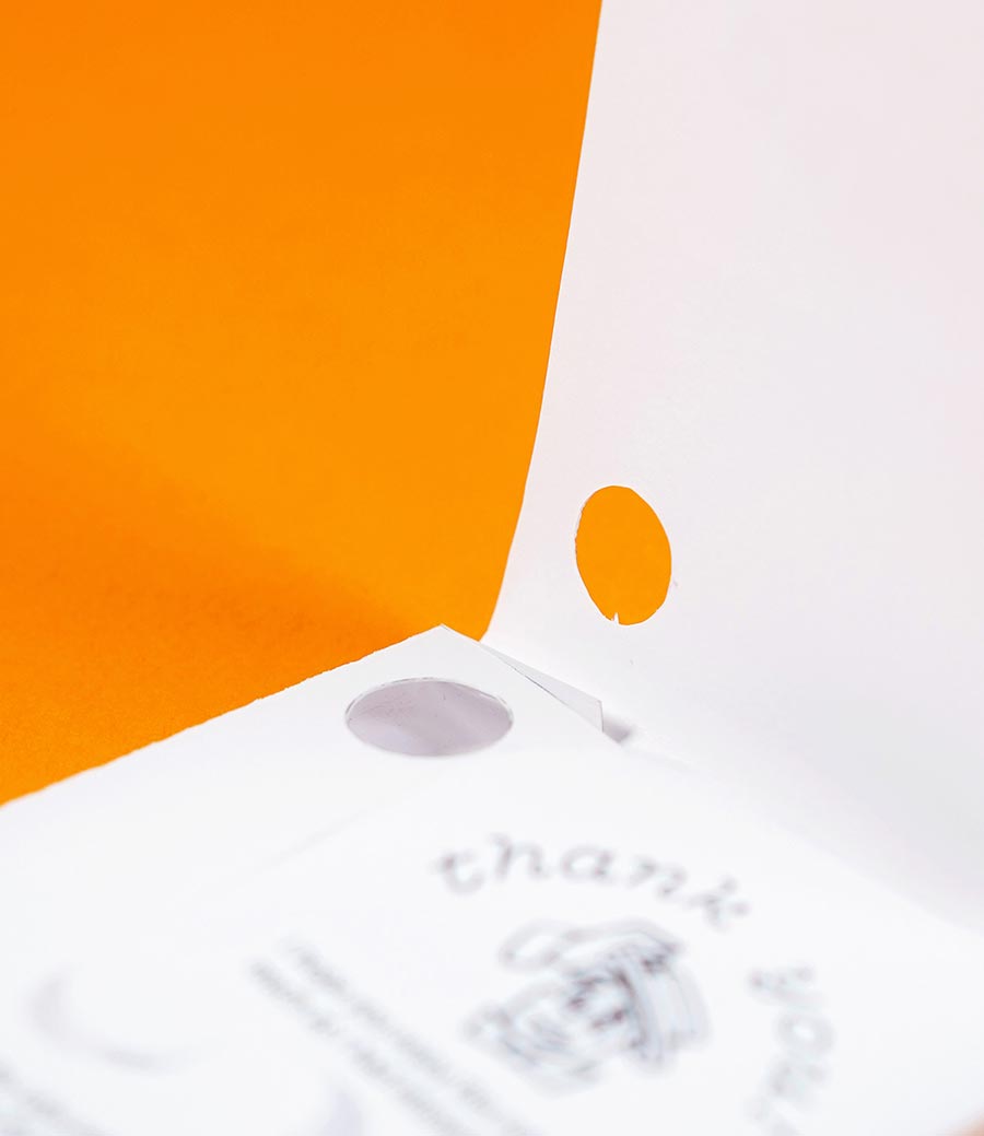 detail of product packaging prototype showing a hole for viewing the notebook inside
