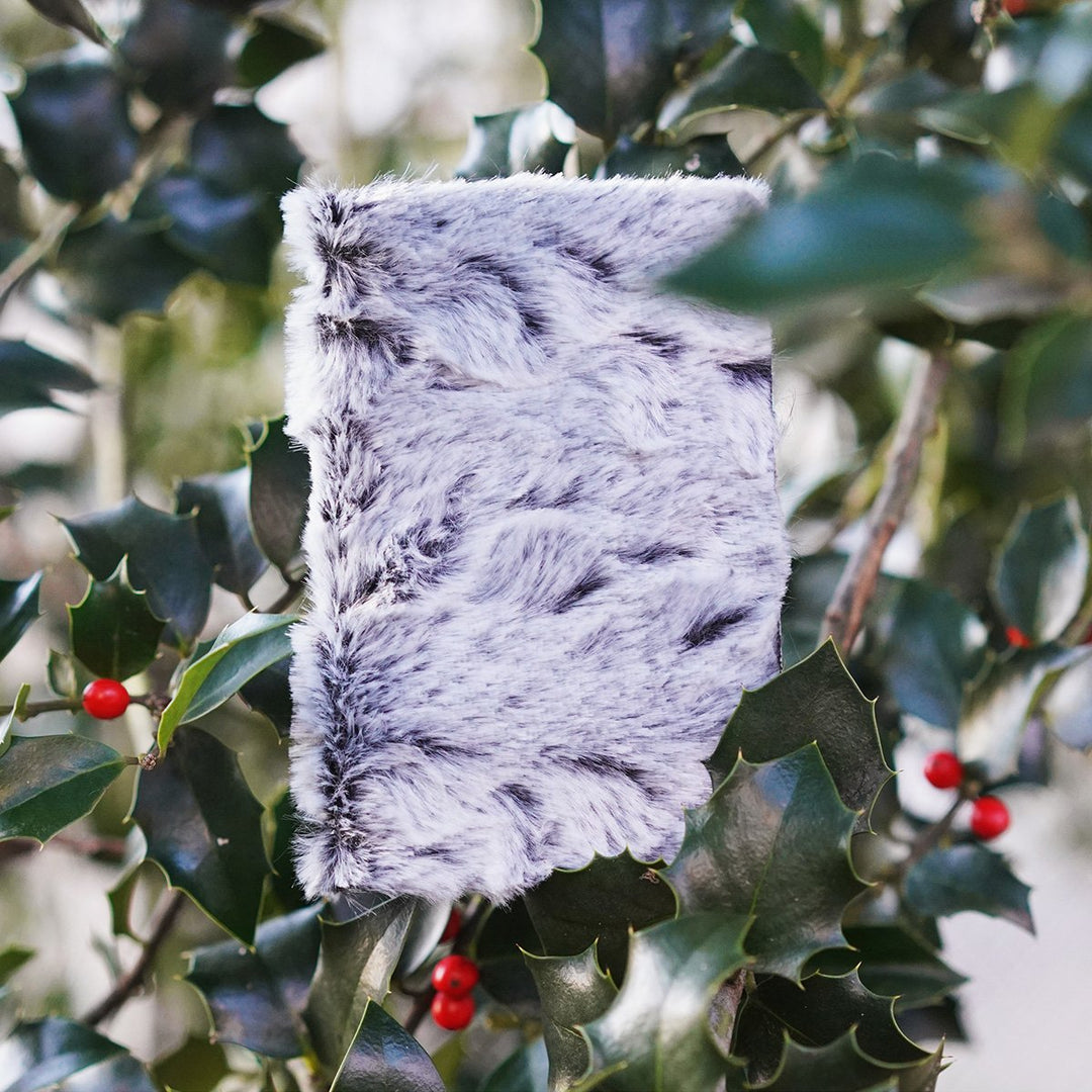 pocket journal in an american holly red berry tree