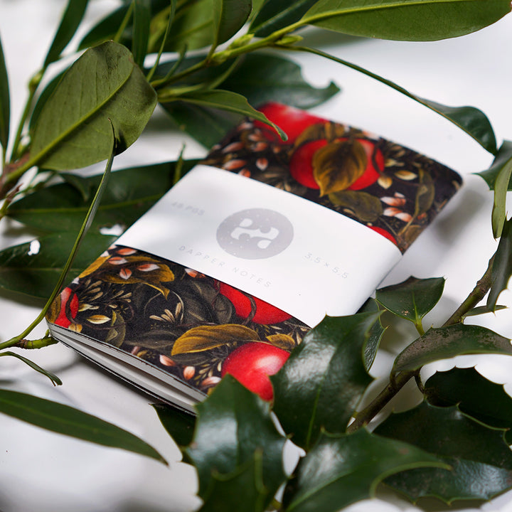 The notebook by @littlepatterns presented inside some foliage for a holiday feel